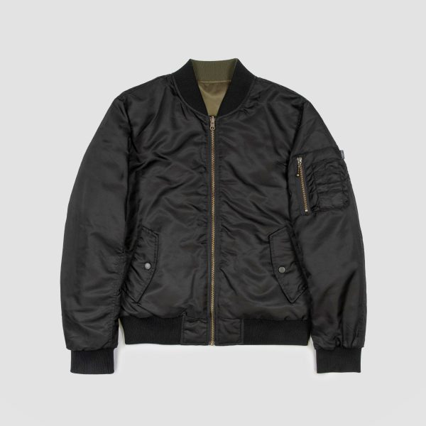 Reversible flight jacket, featuring black and olive green nylon with brass hardware.