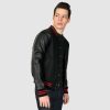 Volume fitted varsity jacket, wool-blend, snap closure, and artificial leather raglan sleeves.