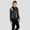 Jet Black and White Artificial Leather. Fitted varsity jacket, textured and grainy artificial leather with snap closure.
