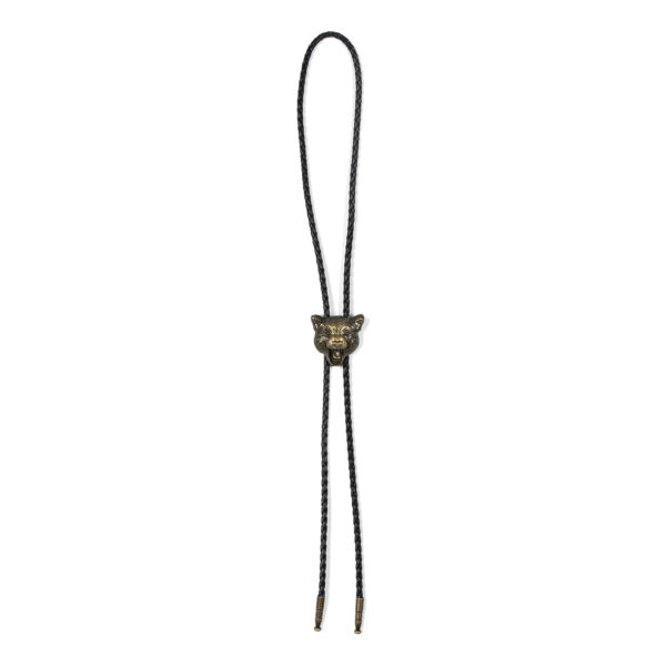 The Gabrielle bolo tie, featuring a 1.5” antique gold plated cheetah and 15.5” black nylon cord. The Gabrielle can be worn as a loose or traditional tie, or as a necklace.