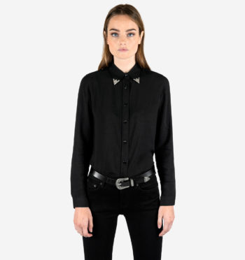 Long sleeve button up black shirt. The collar is secured with decorative metal tips.