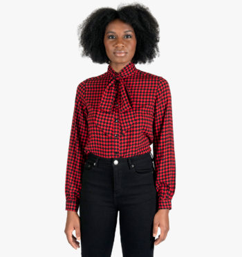 Long sleeve top with bow, featuring a burgundy and black diamond pattern.
