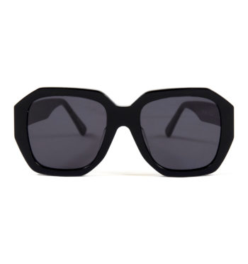 Oversized and angular shape with hand-crafted, black acetate frames.