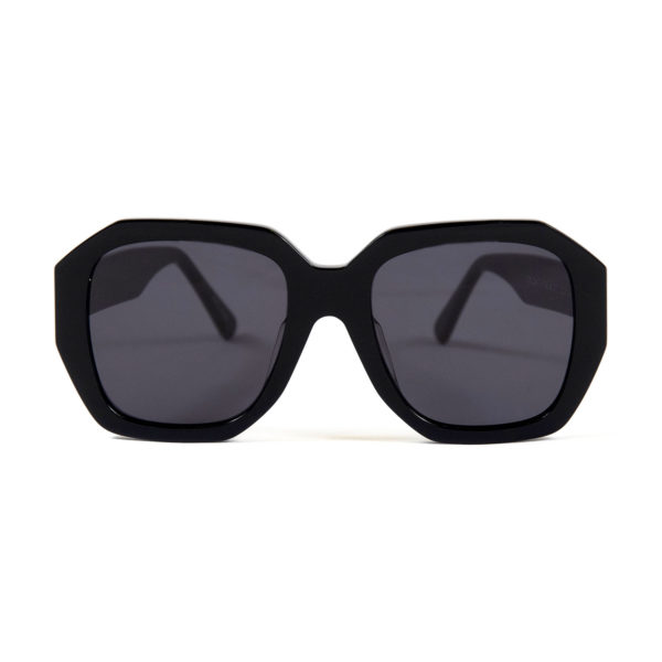 Oversized and angular shape with hand-crafted, black acetate frames.