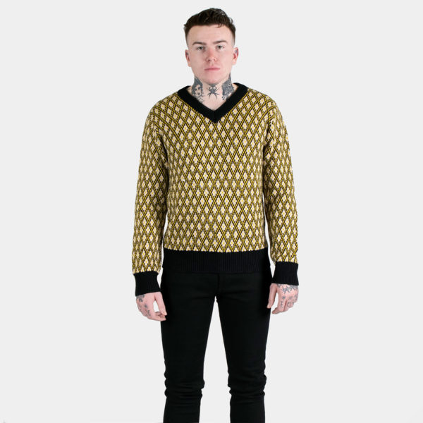 V-neck sweater with vintage-inspired yellow, tan, and black diamond pattern.