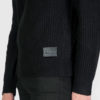 Black sweater with a military-inspired knitting pattern and black on black leather logo patch.