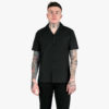 Short sleeve button up black camp shirt with spread collar.