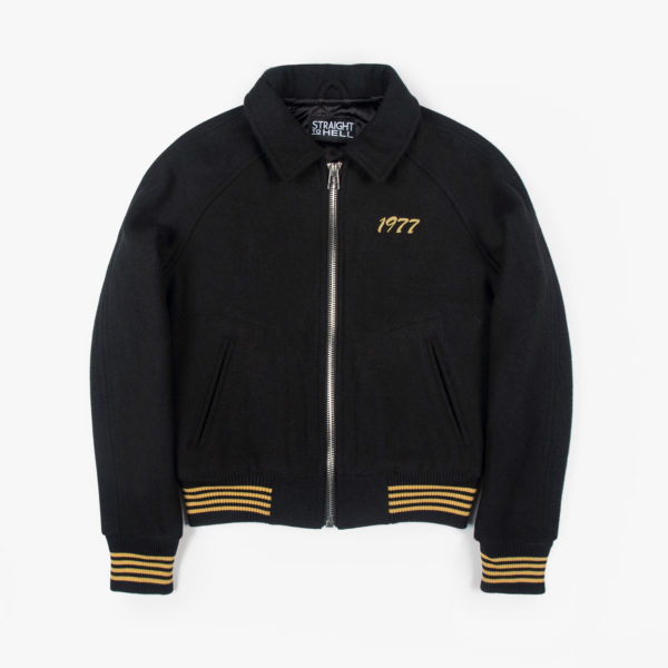 Fitted varsity jacket, chain stitched 1977 on the chest, and zipper closure.