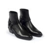 The Libertine is a women’s black, premium leather harness boot