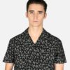 Short sleeve button up camp shirt with leopard print