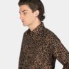 Long sleeve button up leopard print shirt.