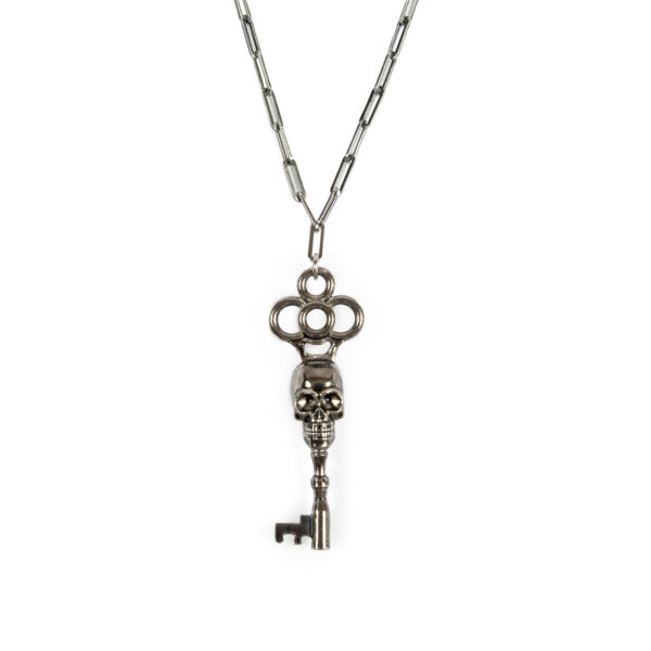 A silver-plated skeleton key necklace that hangs from a long, 18 inch stainless steel chain. The chain length can be adjusted for a shorter chain.