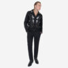 The Wilder is a black gabardine jacket with western details. It features white and metallic gold embroidery in a floral and star pattern.