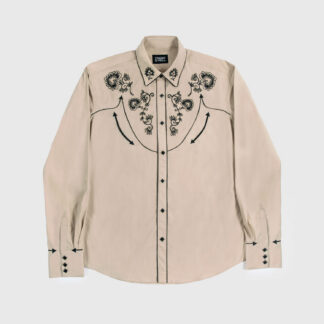 The Hudson is a beige, long-sleeve western shirt with floral embroidery. It also features black piping detail, pocket embroidery, and diamond snap closure.