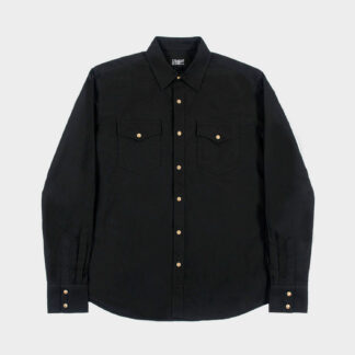 The Direct Action is a long-sleeve shirt made from durable twill with two chest pockets. The beige and brown snap closure stands out against the black fabric. This is our new True fit.