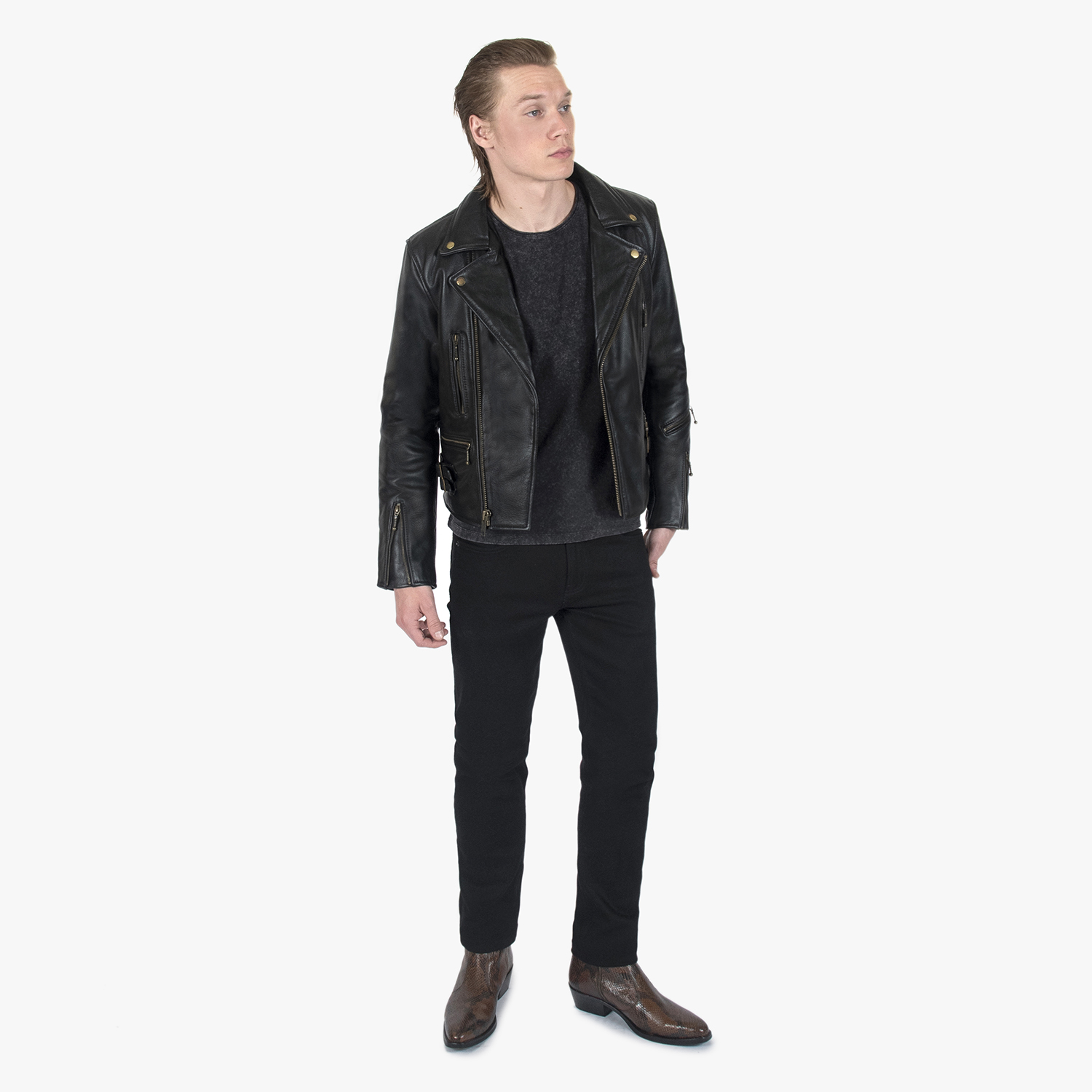 The Defector leather jacket combines old school style with stand-out features, notably a forearm zipper, silver ball pull zippers, side straps, and a curved hem.