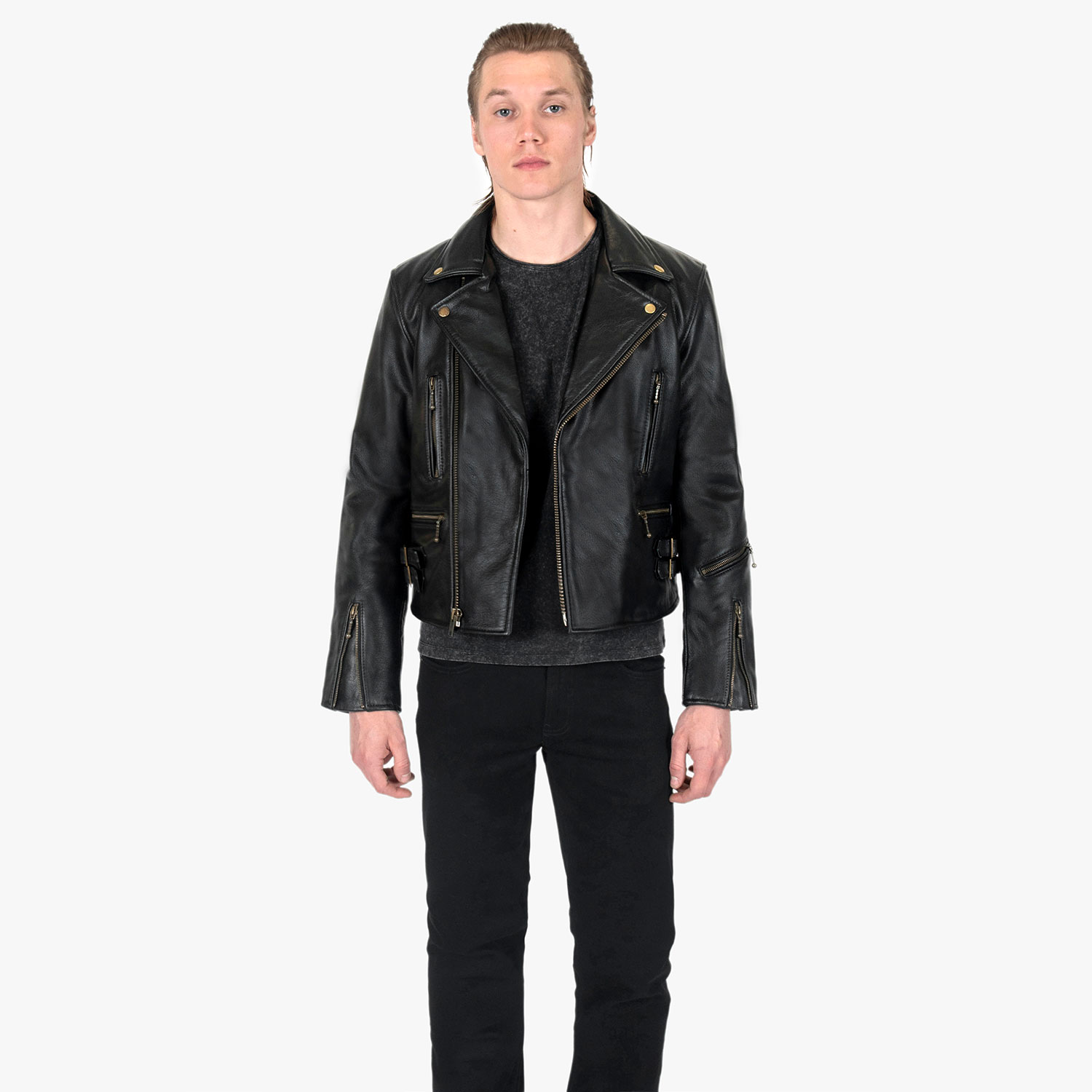 The Defector leather jacket combines old school style with stand-out features, notably a forearm zipper, brass ball pull zippers, side straps, and a curved hem.