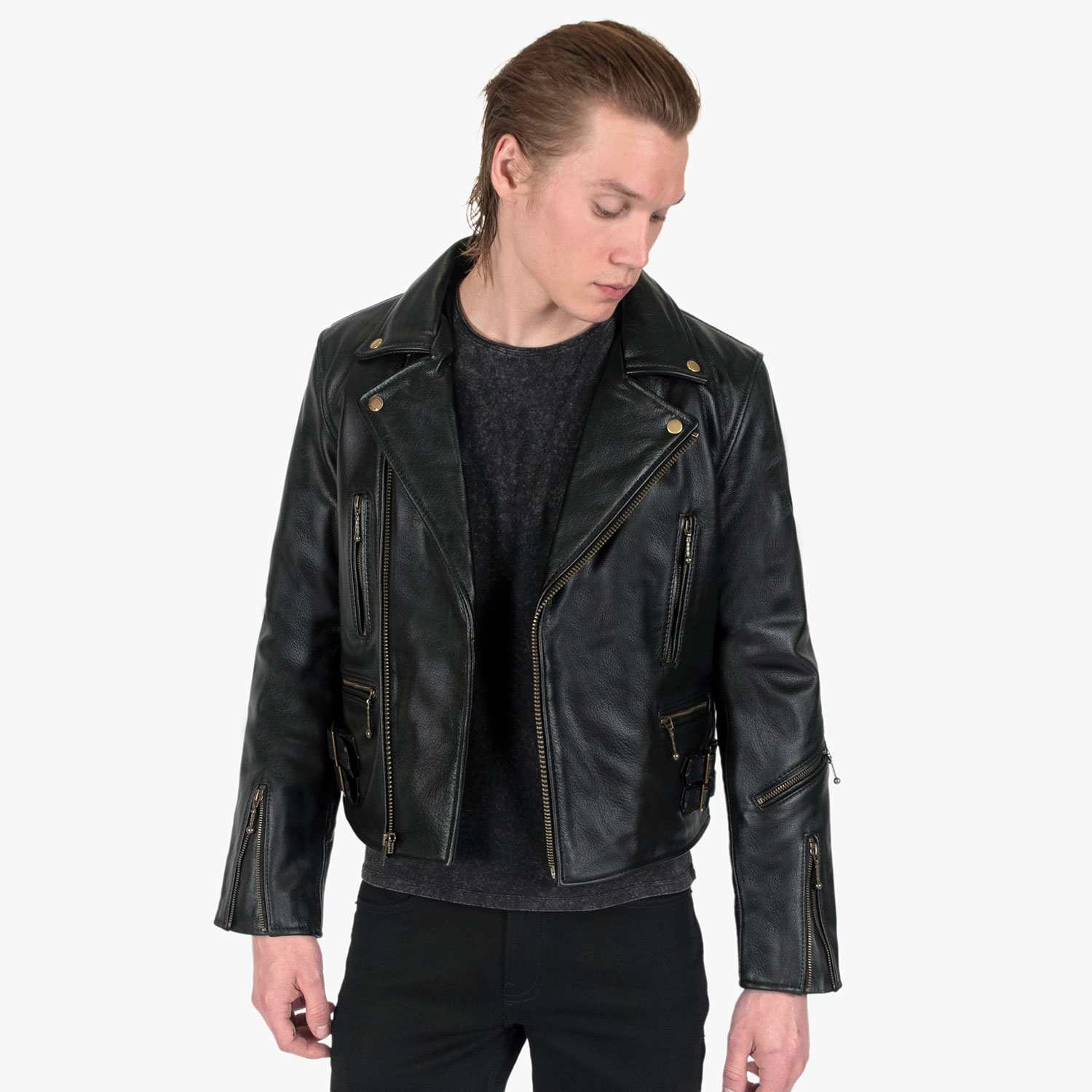 The Defector leather jacket combines old school style with stand-out features, notably a forearm zipper, brass ball pull zippers, side straps, and a curved hem.