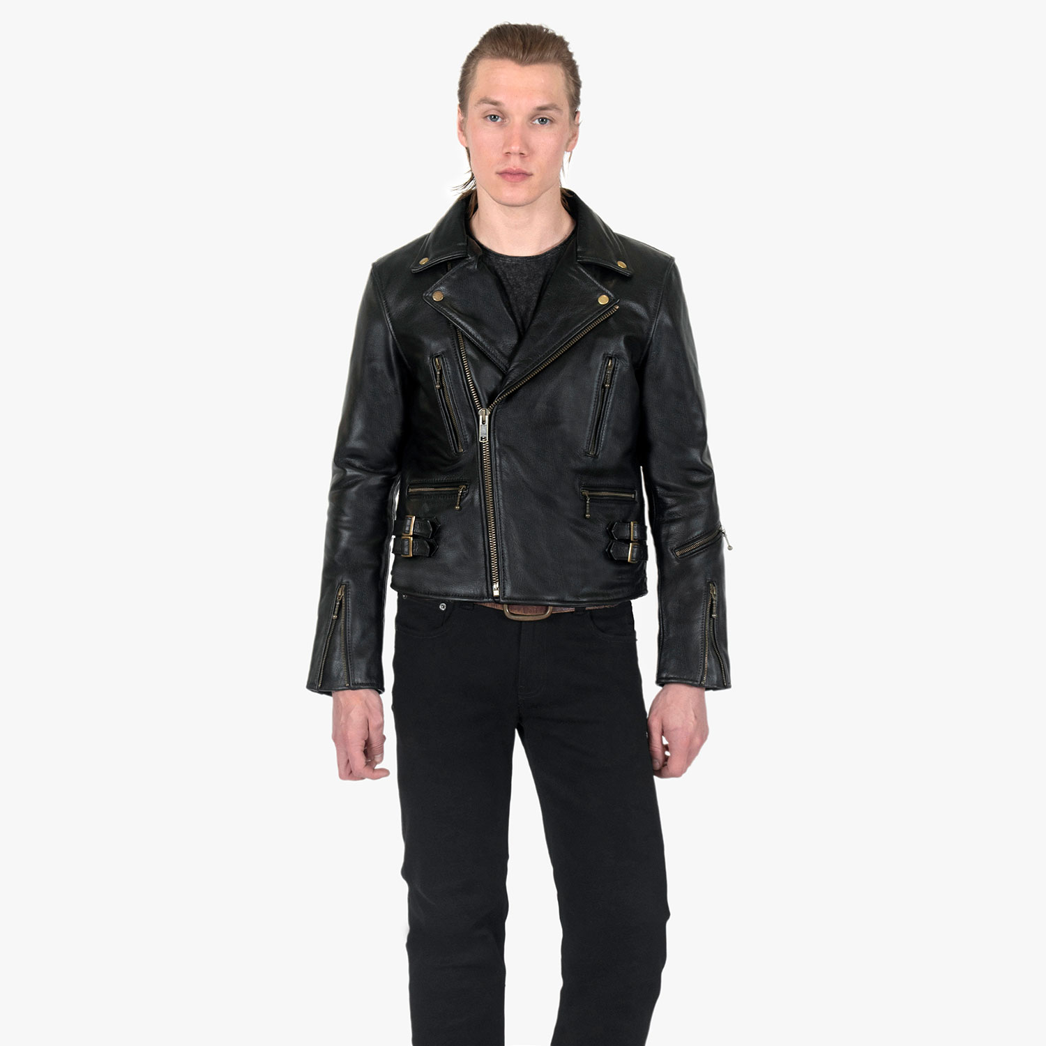 The Defector leather jacket combines old school style with stand-out features, notably a forearm zipper, brass ball pull zippers, side straps, and a curved hem.