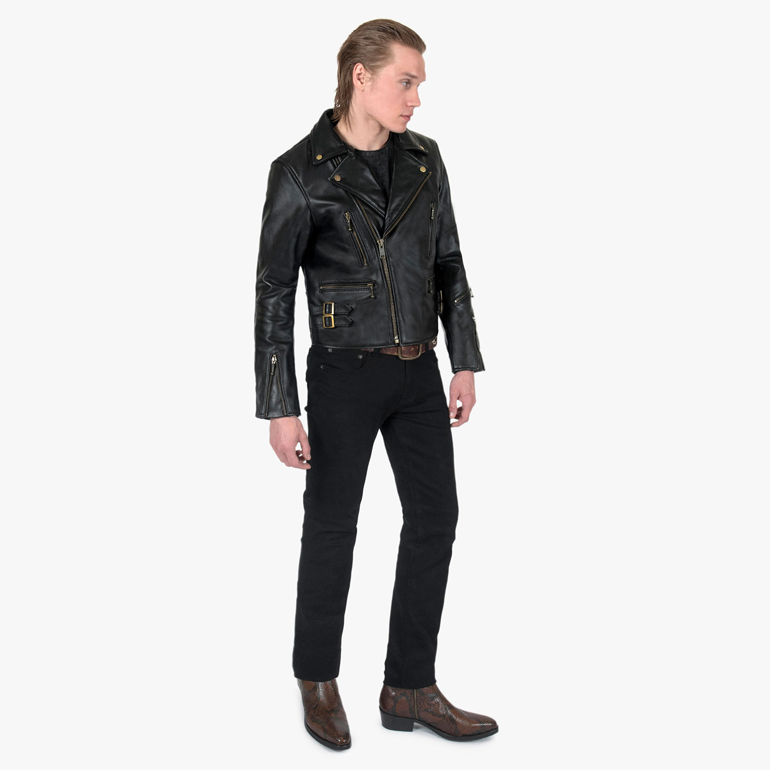 The Defector leather jacket combines old school style with stand-out features, notably a forearm zipper, brass ball pull zippers, side straps, and a curved hem.