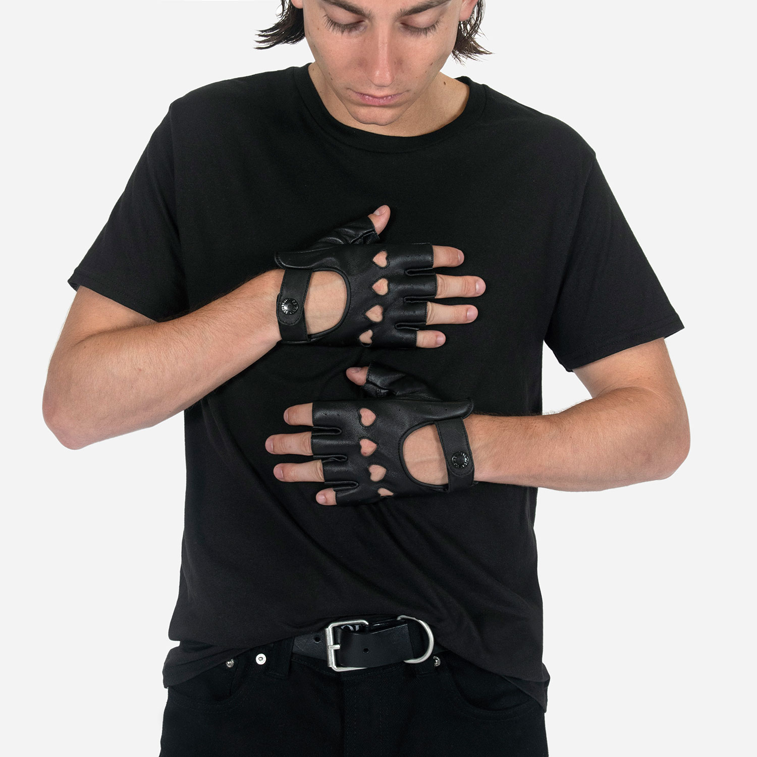 The Heartattack are men’s leather fingerless gloves with cutout hearts for knuckles. Soft leather quickly conforms to your hand’s shape.
