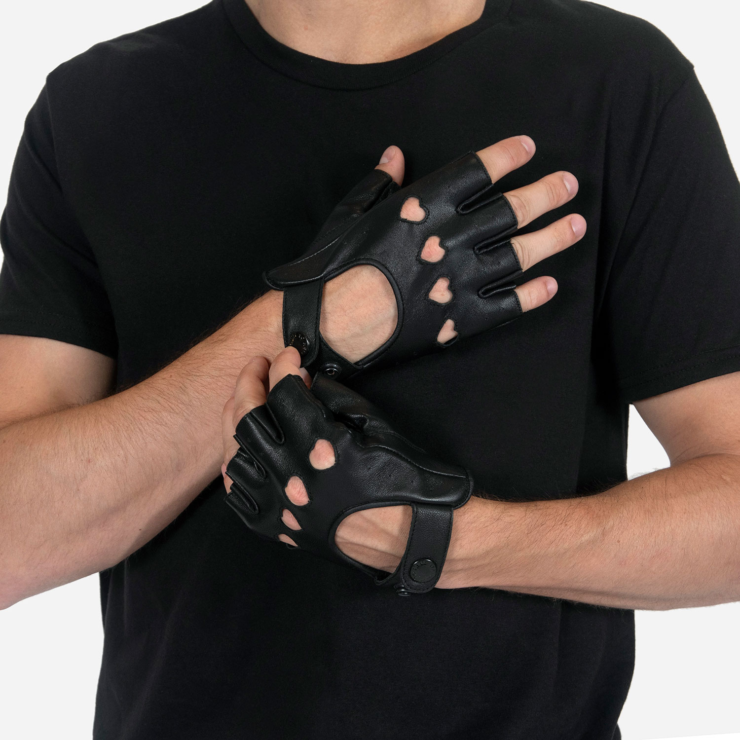 The Heartattack are men’s leather fingerless gloves with cutout hearts for knuckles. Soft leather quickly conforms to your hand’s shape.