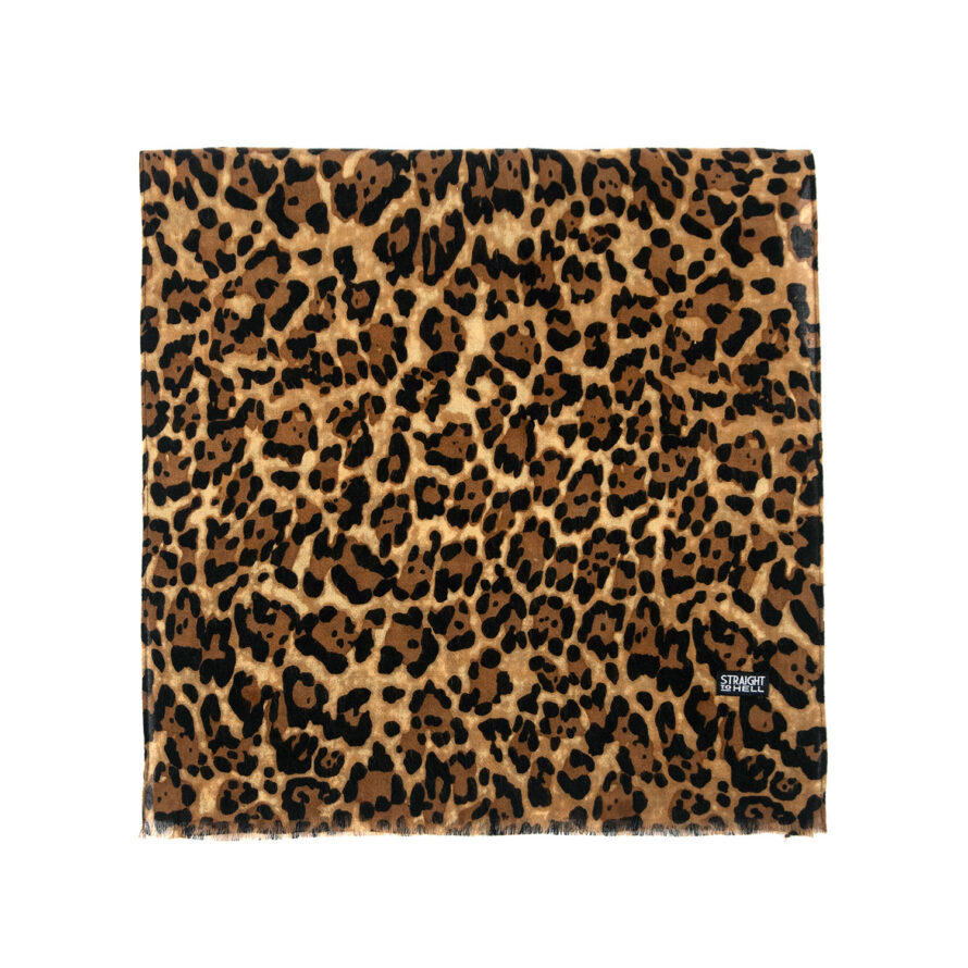 The Lux is a medium weight, leopard print scarf measuring 58 inches. Made to be worn long in front or wrapped around the neck.
