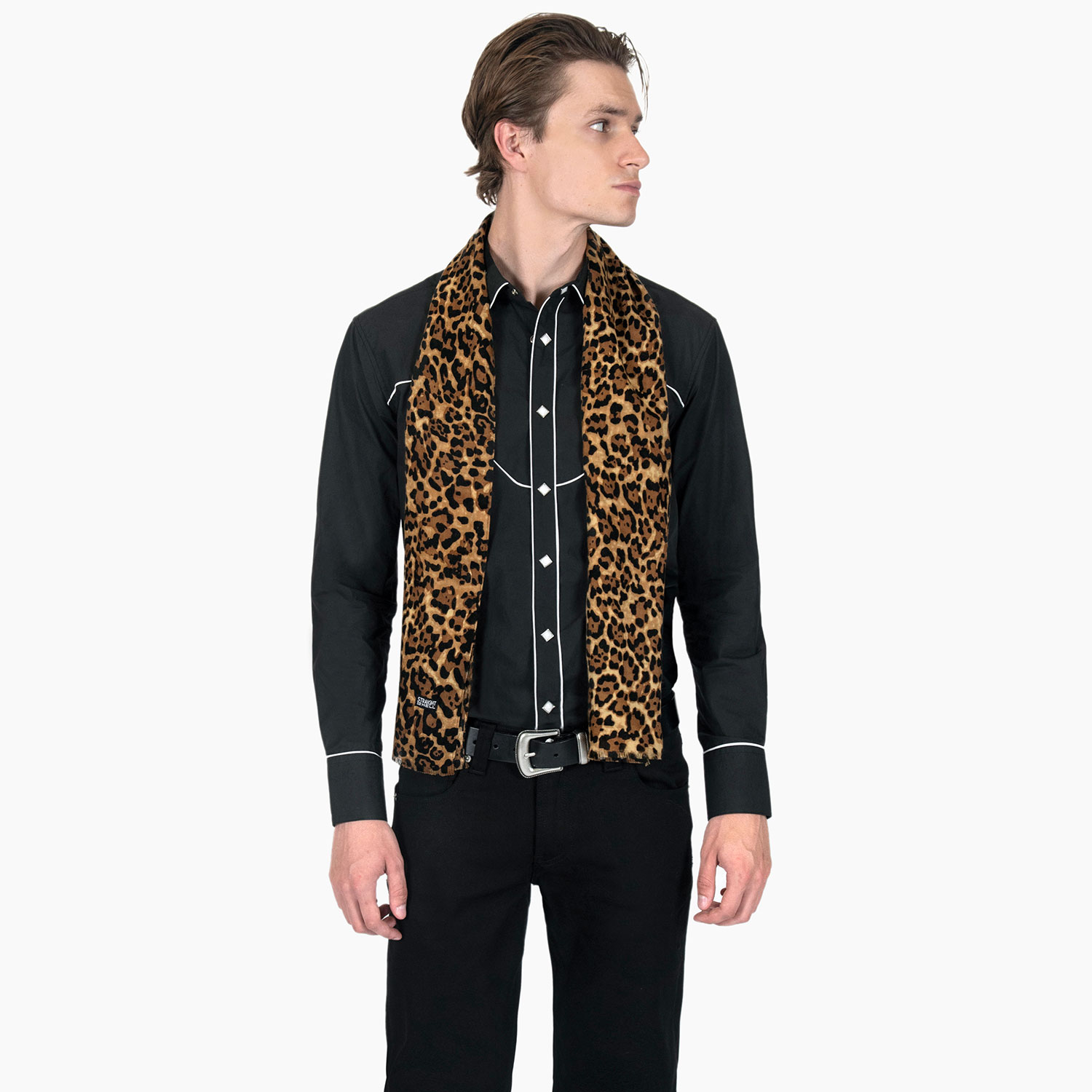 The Lux is a medium weight, leopard print scarf measuring 58 inches. Made to be worn long in front or wrapped around the neck.