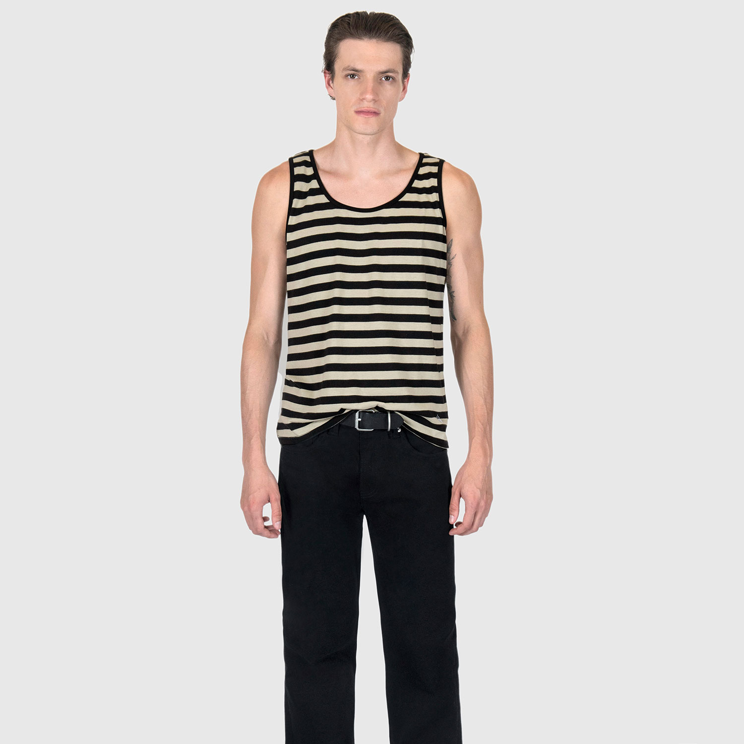 The Richie is a black and cream, short sleeve striped tank top. This soft cotton-poly blend allows the fabric to drape comfortably on your torso. It features a subtle diamond embroidered on the lower corner. This is our Bucktown fit.