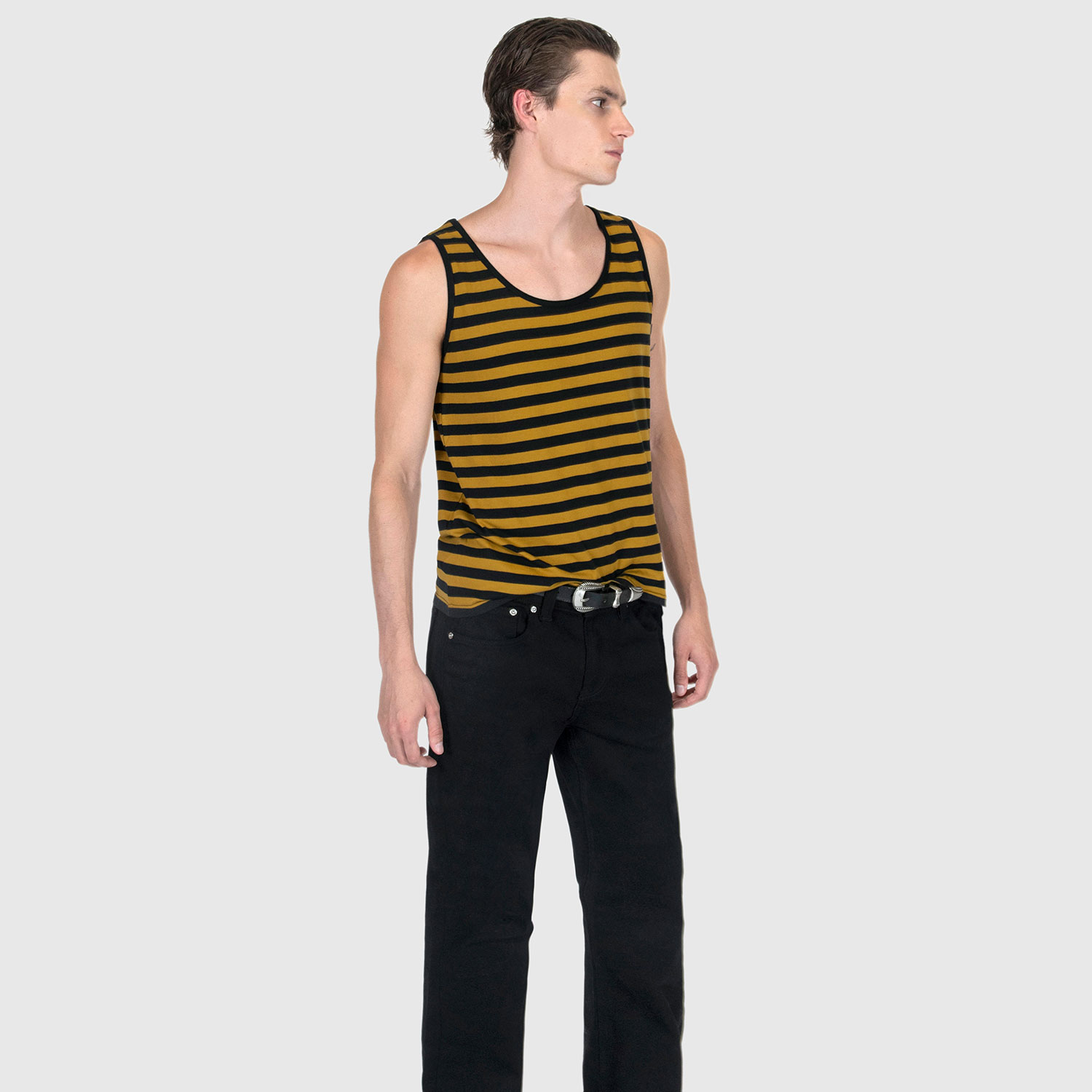 The Richie is a black and yellow striped tank top. This soft cotton-poly blend allows the fabric to drape comfortably on your torso. It features a subtle diamond embroidered on the lower corner.