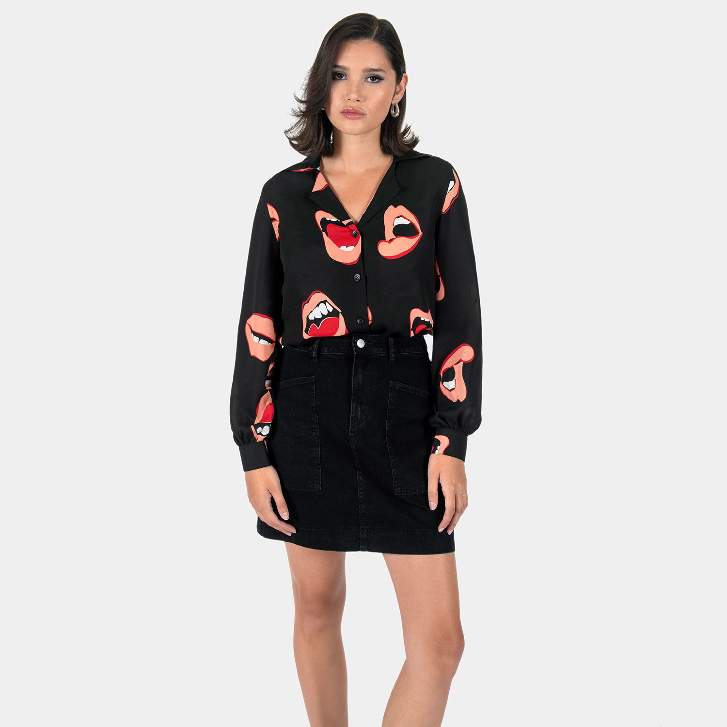 The Talk To Me long sleeve shirt, filled with retro open mouth artwork. Semi-sheer fabric meets a deep-V button-up closure and subtle balloon sleeves. This is our Casual fit.