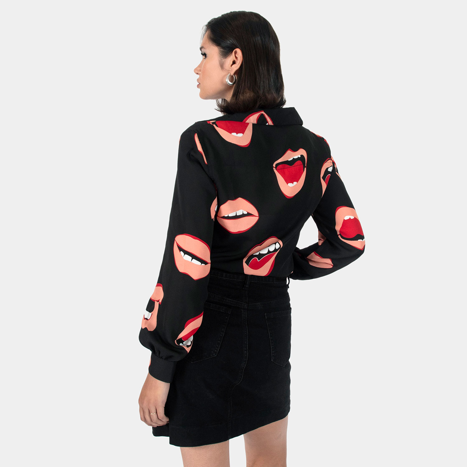The Talk To Me long sleeve shirt, filled with retro open mouth artwork. Semi-sheer fabric meets a deep-V button-up closure and subtle balloon sleeves. This is our Casual fit.