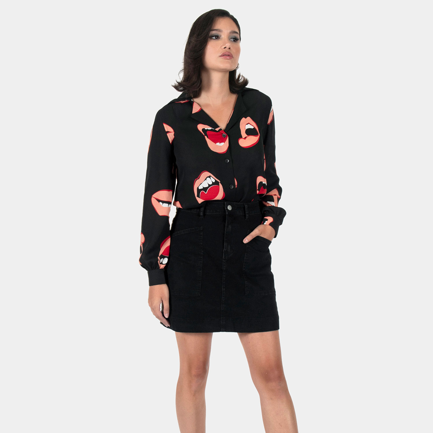 The Talk To Me long sleeve shirt, filled with retro open mouth artwork. Semi-sheer fabric meets a deep-V button-up closure and subtle balloon sleeves. This is our Casual fit.