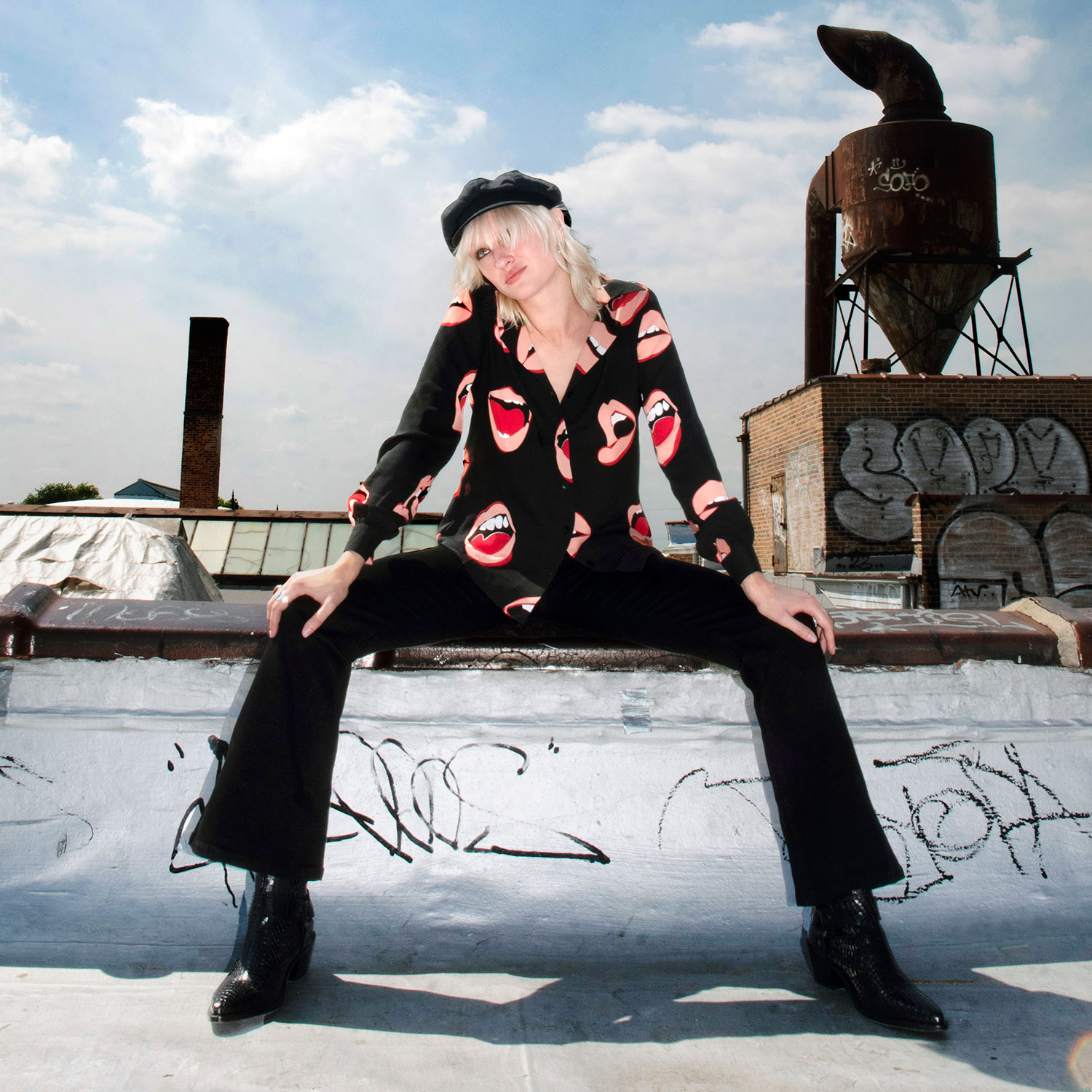 The Talk To Me long sleeve shirt, filled with retro open mouth artwork. Semi-sheer fabric meets a deep-V button-up closure and subtle balloon sleeves. This is our Casual fit.