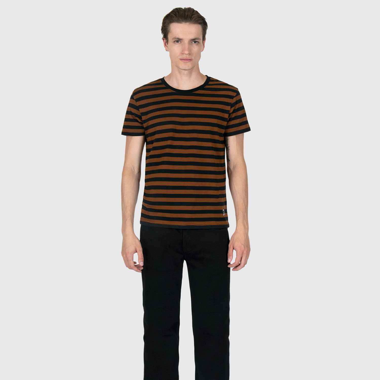 The Teddy is a black and yellow, short sleeve striped t-shirt. This soft cotton-poly blend allows the fabric to drape comfortably on your torso. It features a subtle music note embroidered on the lower corner. This is our Bucktown fit.