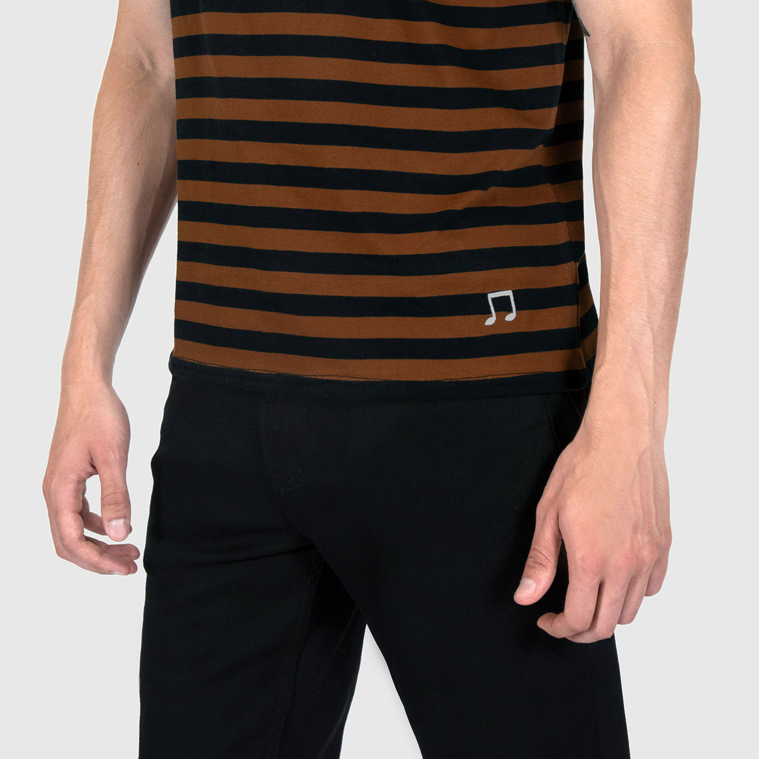 The Teddy is a black and yellow, short sleeve striped t-shirt. This soft cotton-poly blend allows the fabric to drape comfortably on your torso. It features a subtle music note embroidered on the lower corner. This is our Bucktown fit.
