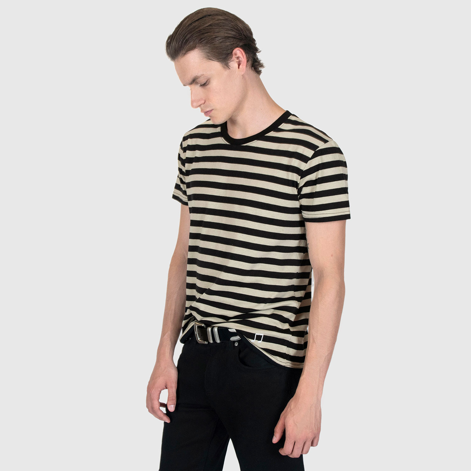 The Teddy is a black and cream, short sleeve striped t-shirt. This soft cotton-poly blend allows the fabric to drape comfortably on your torso. It features a subtle music note embroidered on the lower corner. This is our Bucktown fit.