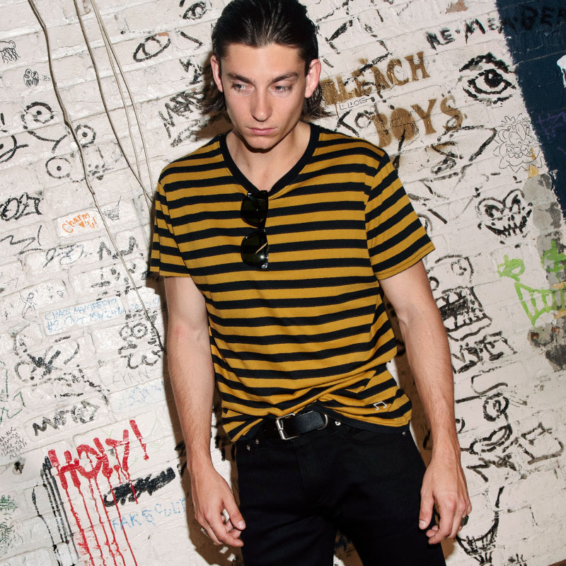 The Teddy is a black and yellow, short sleeve striped t-shirt. This soft cotton-poly blend allows the fabric to drape comfortably on your torso. This is our Bucktown fit.