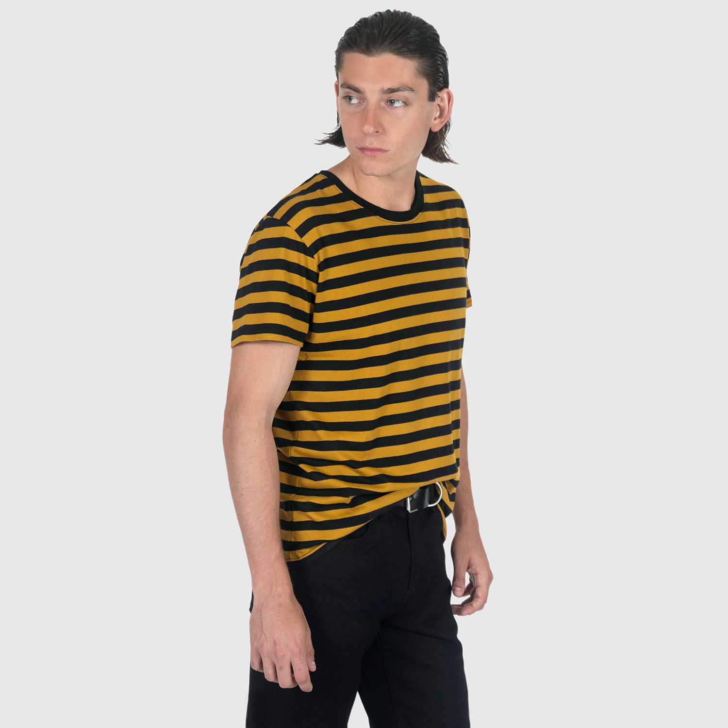 The Teddy is a black and yellow, short sleeve striped t-shirt. This soft cotton-poly blend allows the fabric to drape comfortably on your torso. This is our Bucktown fit.