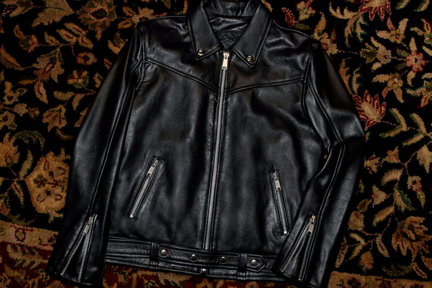 The Tribe leather jacket keeps things simple without sacrificing character. The diagonal chest seam detailing adds a subtle edge without complicating the design. A unique snap belt gives this classic style its own identity. Featuring a snap collar, vertical zipper closure, side pockets, and our Modern fit. All the attitude of a classic moto jacket, with a clean look that works just about anywhere. Made from premium leather that softens, relaxes, and conforms to your shape with wear, only getting better over time.