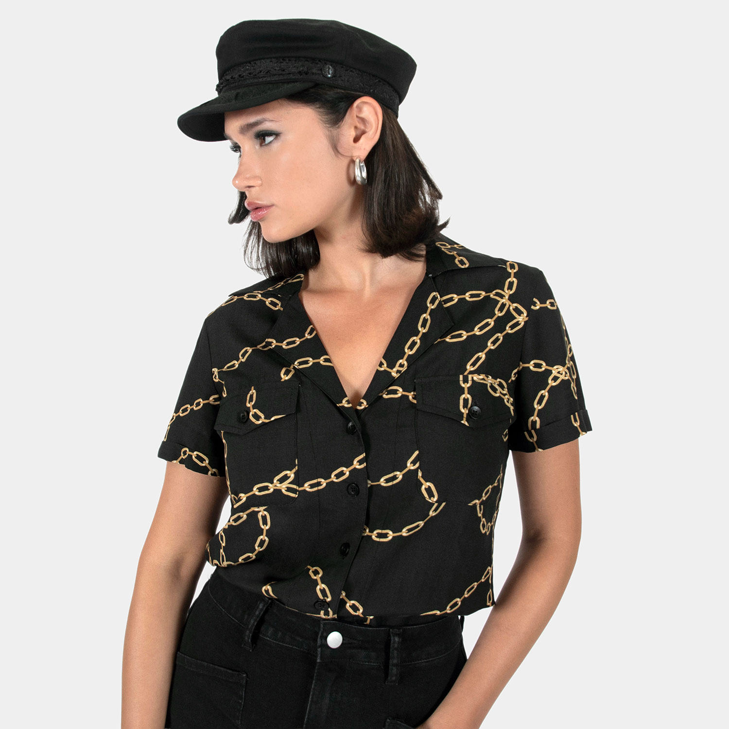 The Chains of Love shirt, filled with our chains artwork. Soft cream fabric meets a deep-V button-up closure, dual chest pockets, and cuffed short sleeves in our Casual fit.