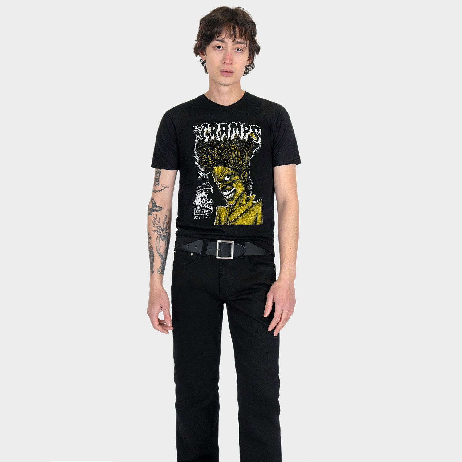 The Cramps official t-shirts are here for a limited time. Bad Music for Bad People goes hard, pulling artwork from the front and back of this perfect record featuring the unmistakable likeness of singer Lux Interior. We also mixed the cover art with mid-’80s promotional Cramps imagery. When your rotation needs something louder, this tee has you covered. Made from soft cotton and printed in-house in Chicago. This is our Everyday fit. Available with a single-sided front print or go double-sided with artwork on the front and back. Let’s talk about The Cramps and their shocking sound. Trashy, primitive punk and garage rock collide with raw R&B, fuzzed-out rockabilly gone wrong, B-movie sleaze, and ’50s rock ‘n’ roll dragged through the gutter. Do you get it now? Good.