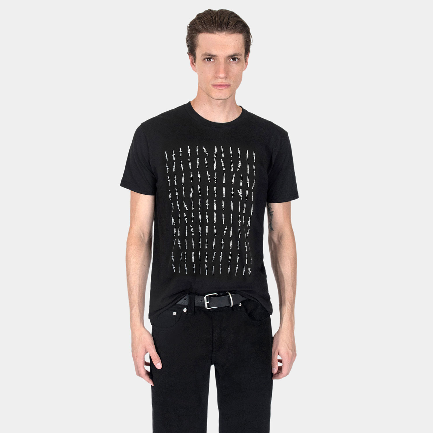 119 daggers, all different. And one rose. Artwork that makes its point without having to spell anything out. Short sleeve t-shirt made from soft cotton. Printed in-house in Chicago. This is our Everyday fit.