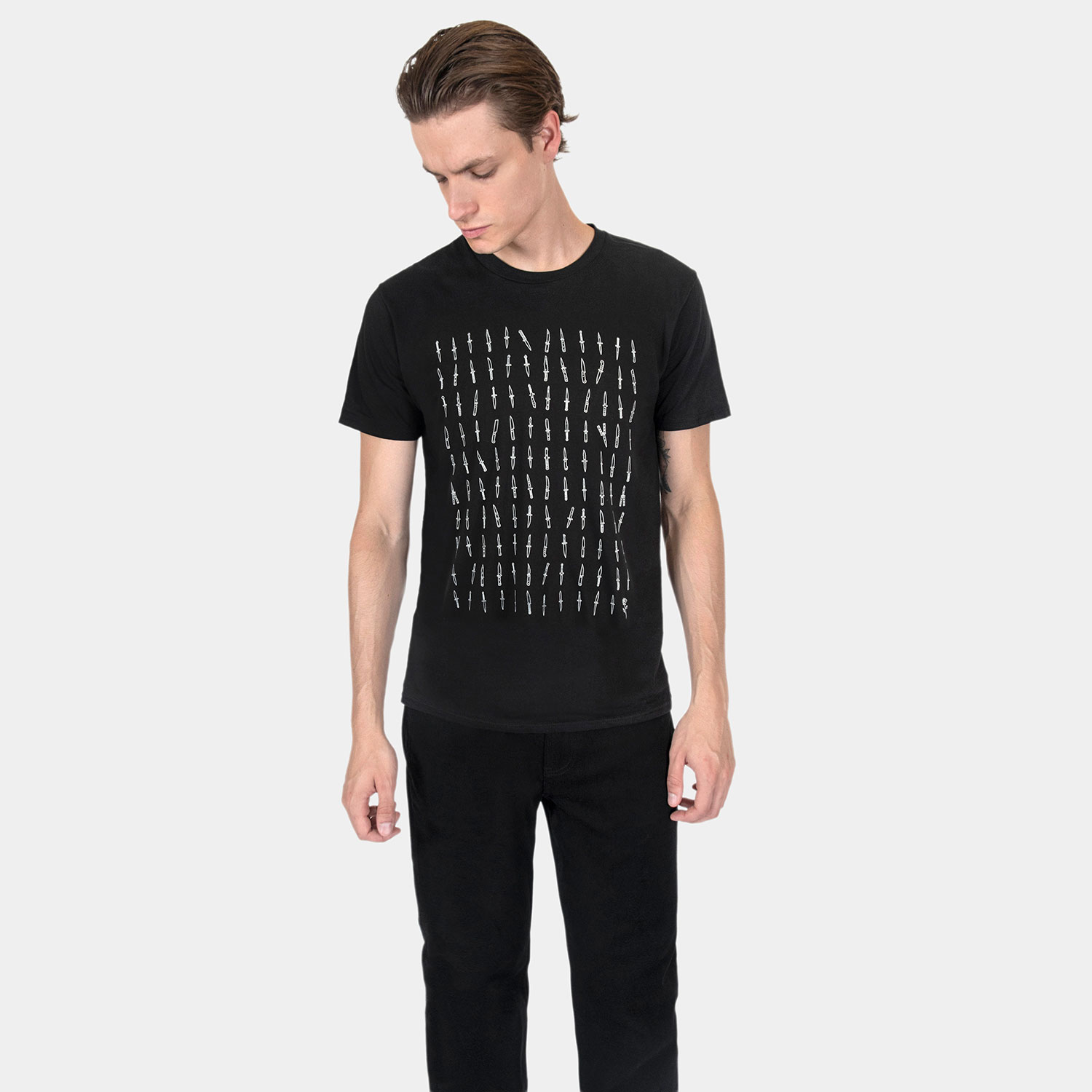 119 daggers, all different. And one rose. Artwork that makes its point without having to spell anything out. Short sleeve t-shirt made from soft cotton. Printed in-house in Chicago. This is our Everyday fit.