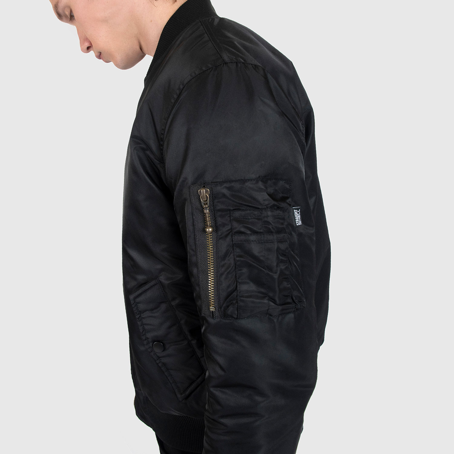Reversible flight jacket, featuring black and burgundy nylon with brass hardware. Two different color styles in one jacket, so you’ve always got another option. Side pockets and classic utility bicep pocket with STH woven label. Durable elastic cuffs, waistband, and neck. This is our Proper fit.