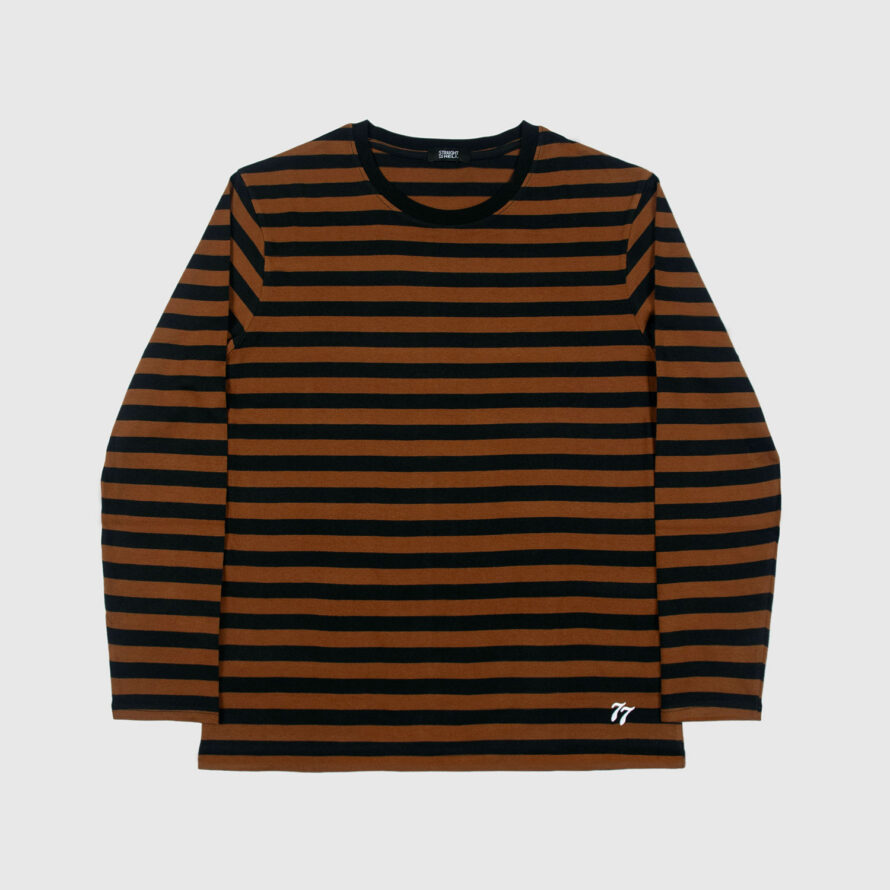 The Fitz 77 is a black and brown striped, long sleeve t-shirt. This soft cotton-poly blend allows the fabric to drape comfortably on your torso. It features a subtle 77 embroidered on the lower corner. This is our Bucktown fit.
