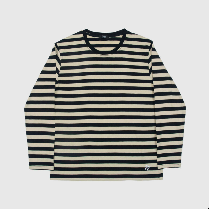 The Fitz 77 is a black and cream striped, long sleeve t-shirt. This soft cotton-poly blend allows the fabric to drape comfortably on your torso. It features a subtle 77 embroidered on the lower corner. This is our Bucktown fit.