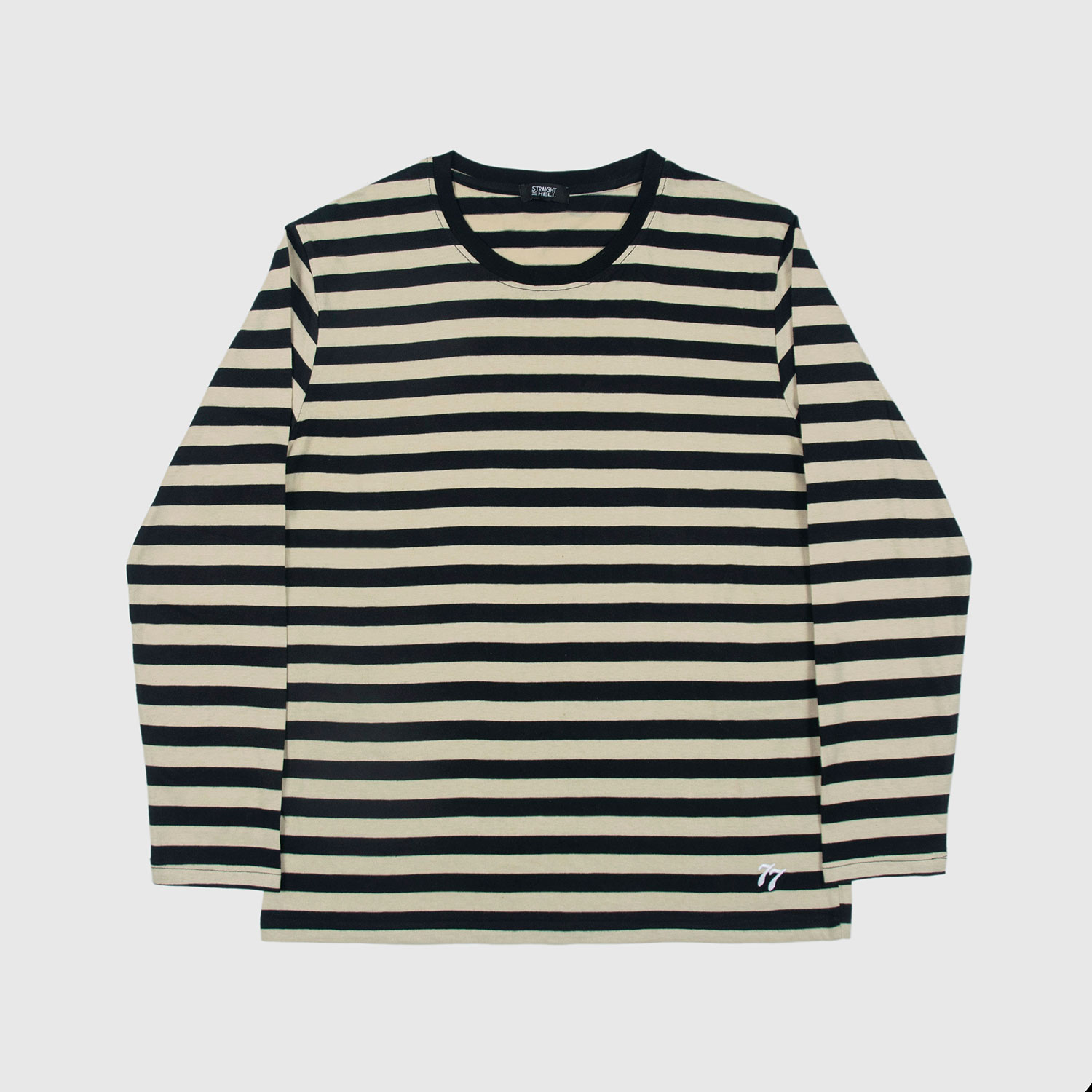 The Fitz 77 is a black and cream striped, long sleeve t-shirt. This soft cotton-poly blend allows the fabric to drape comfortably on your torso. It features a subtle 77 embroidered on the lower corner. This is our Bucktown fit.
