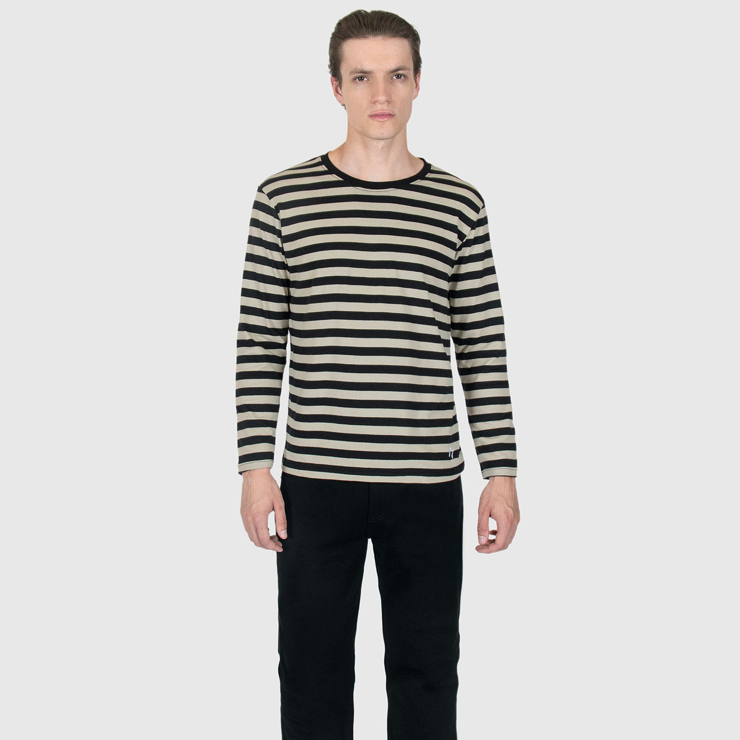 The Fitz 77 is a black and cream striped, long sleeve t-shirt. This soft cotton-poly blend allows the fabric to drape comfortably on your torso. It features a subtle 77 embroidered on the lower corner. This is our Bucktown fit.