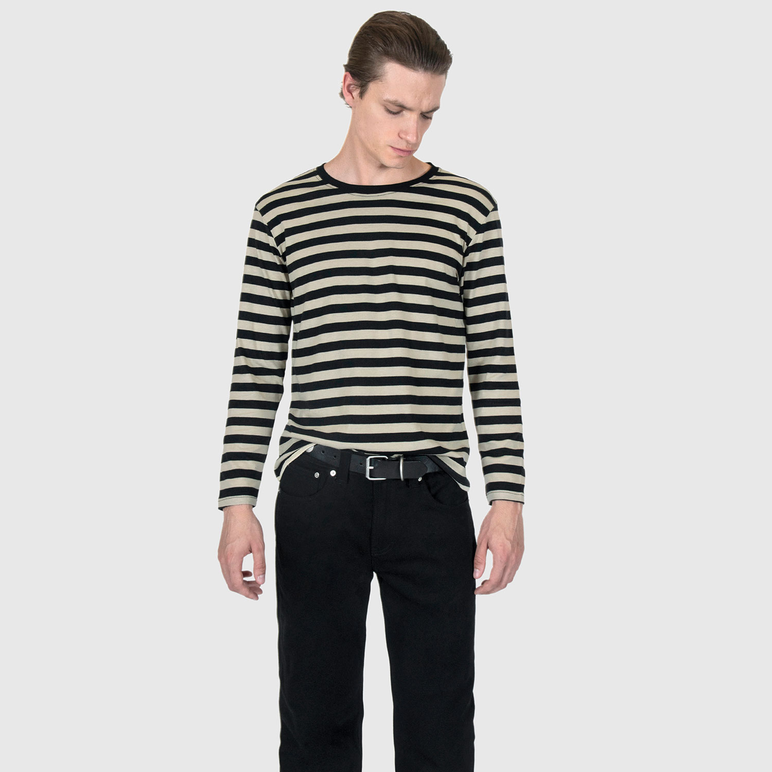 The Fitz 77 is a black and cream striped, long sleeve t-shirt. This soft cotton-poly blend allows the fabric to drape comfortably on your torso. It features a subtle 77 embroidered on the lower corner. This is our Bucktown fit.